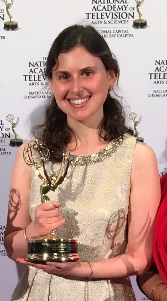 Abby holding her Emmy award