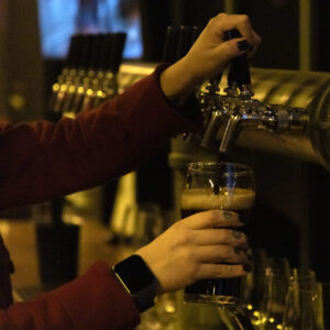Bartender Alex Rodriguez fills a glass of beer at Pariah Brewing Company in Baltimore, Md. on February 3, 2022.